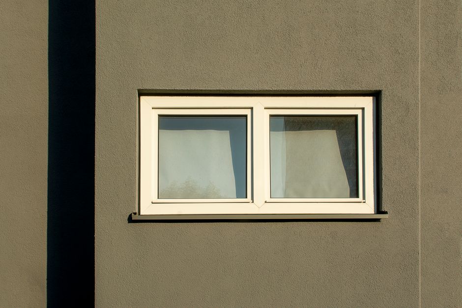 Clean white vinyl window frame installed in a residential home